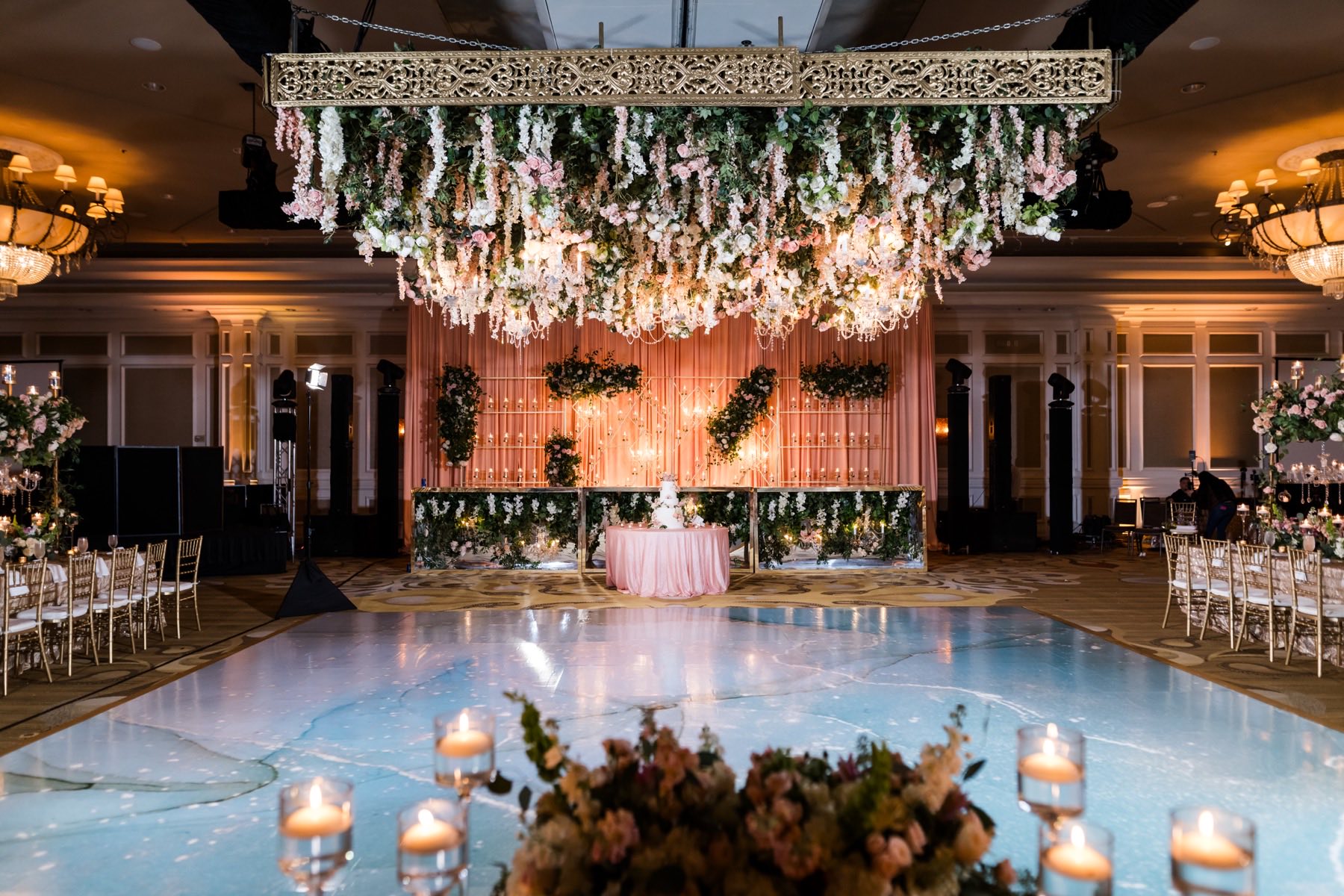 Grand wedding reception with stunning decor and joyful guests on the dance floor
