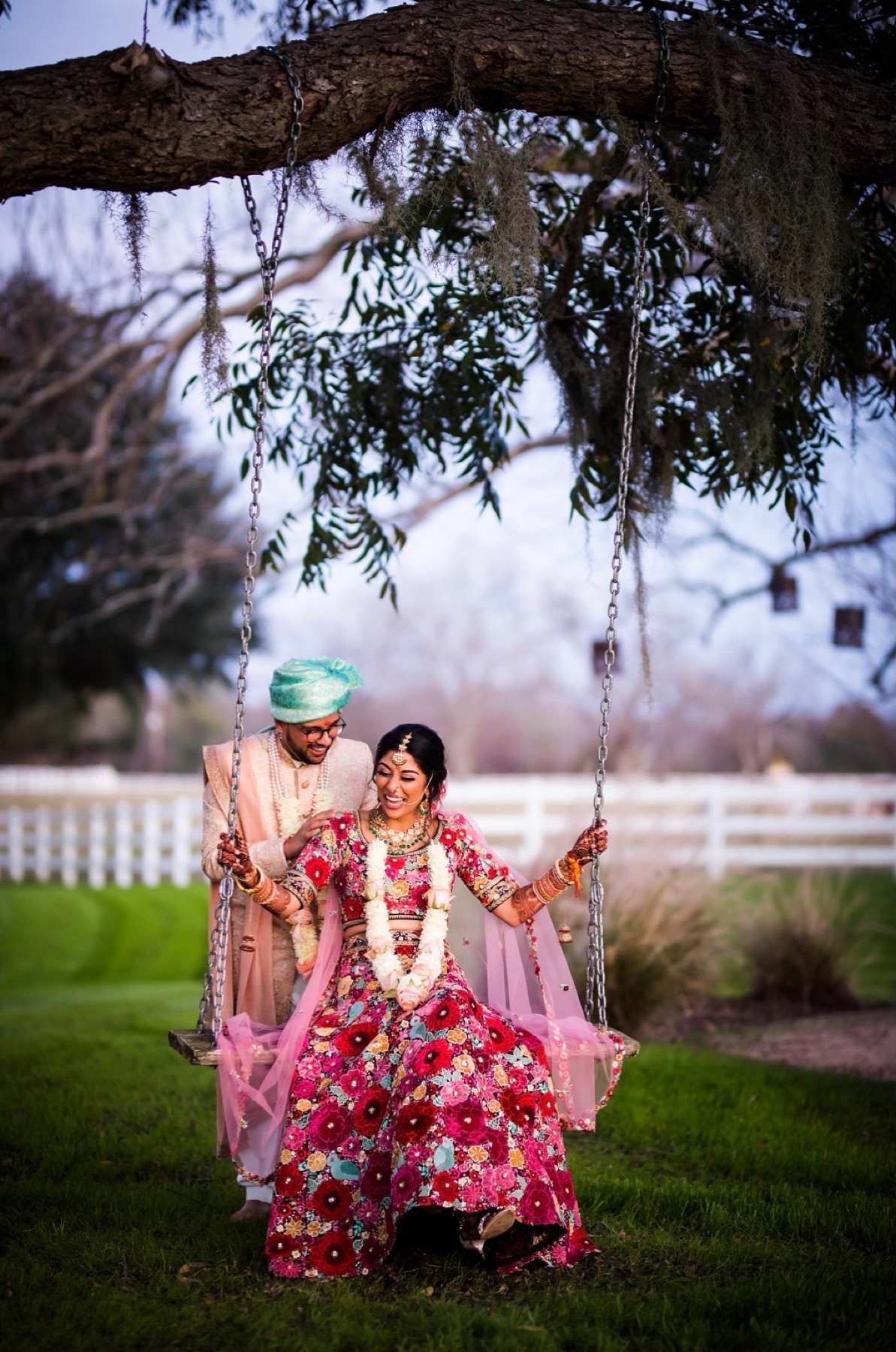 Couple sharing a joyful moment together on a garden swing