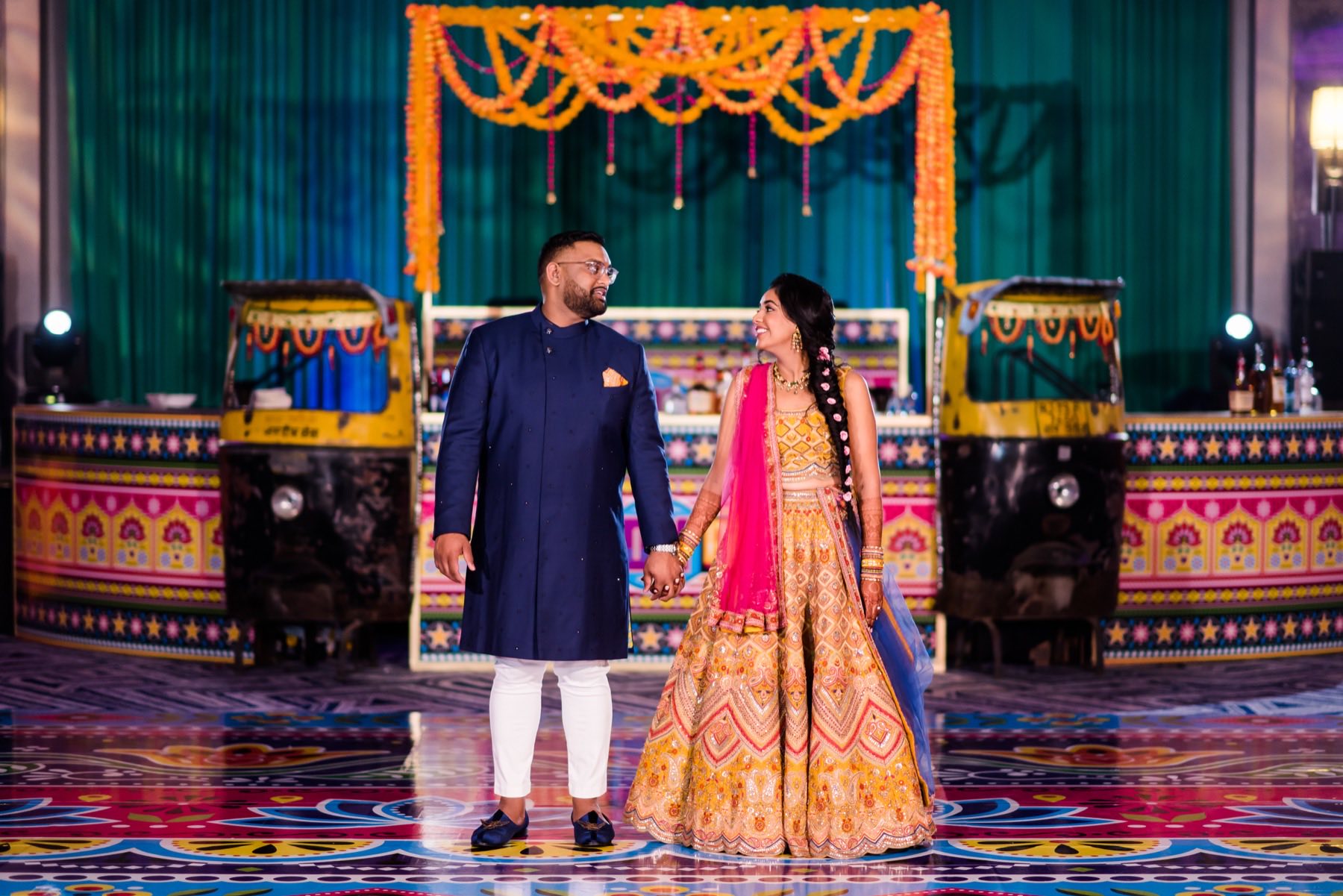 Elegant wedding portrait with beautiful floral backdrop